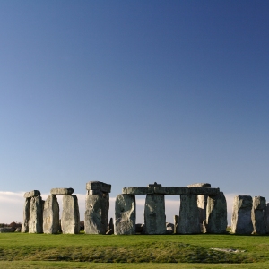 The Stonehenge monument against a clear blue sky