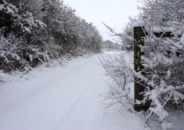 Snow covered winter road after a heavy snowfall