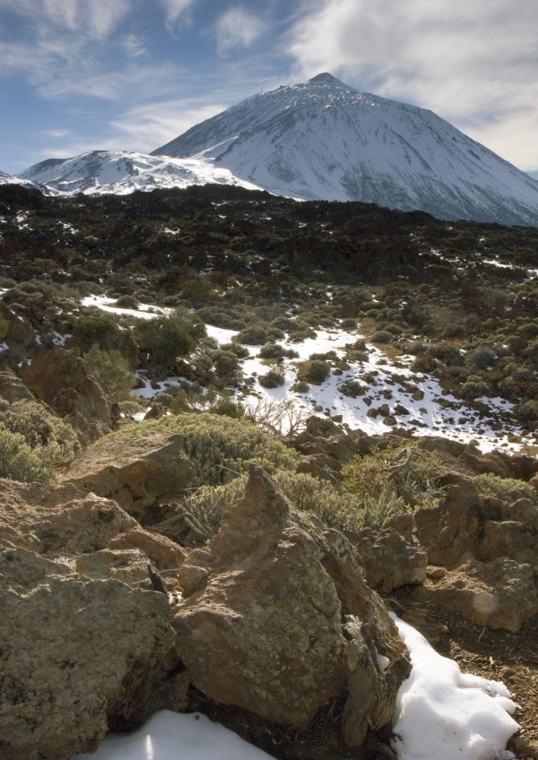 El Teide across a snow covered desert landscape