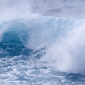 Blue seas, big waves on the beach