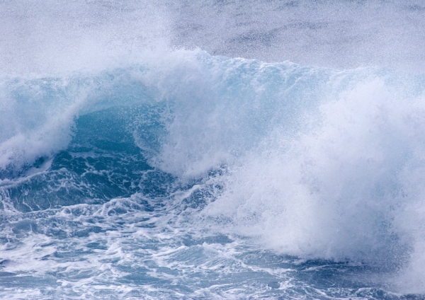 Blue seas, big waves on the beach