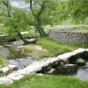 A mountain stream with stepping stones at Malham in the Yorkshire Dales