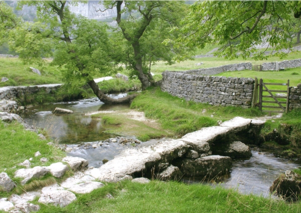 A mountain stream with stepping stones at Malham in the Yorkshire Dales