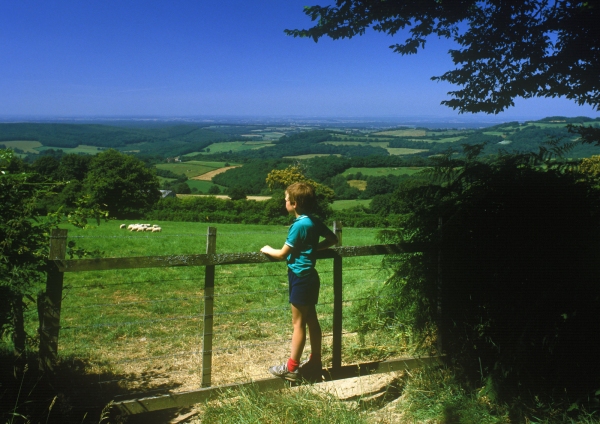 A young boy admiring the view in the Auvergne in Southern France