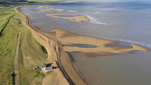 Aerial view of the mouth of the river alde at shingle street, looking towards orford ness