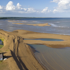 Aerial view of the suffolk coastline at Shingle Street looking towards Orford in the late afternoon