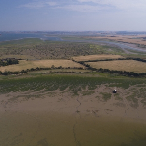 An aerial photograph of the Essex coast and Blackwater estuary at Heybridge Basin, near Maldon in Essex