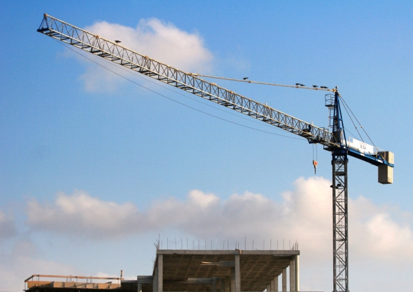 A large building site crane on a large construction site