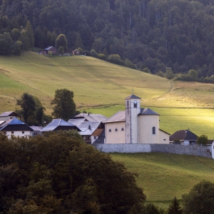 Early morning photo of an alpine village with church in the haute savoie region of France