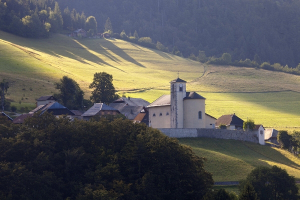 Early morning sunrise in Montmin in the French Alps, with the village church centre