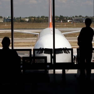 Passengers waiting in an airport lounge