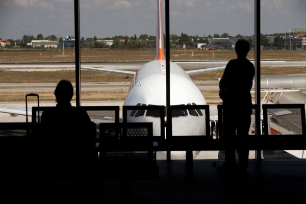 Passengers waiting in an airport lounge