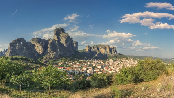 Panoramic view of the Kalambaka town at the foot of the Meteora Mountains in Greece on a sunny summer day