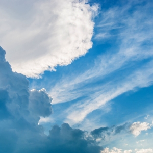 Blue sky with cumulus and cumulo nimbus cloud formations