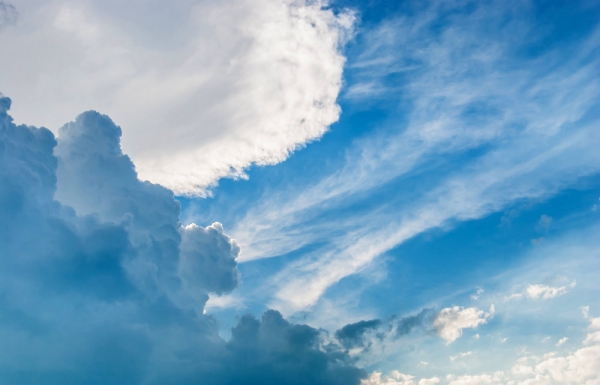 Blue sky with cumulus and cumulo nimbus cloud formations