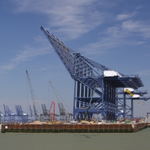 Dockside cranes and ships unloading at a major UK container port