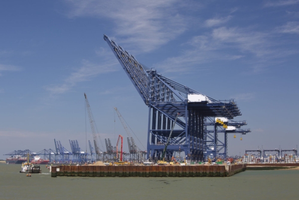 Dockside cranes and ships unloading at a major UK container port