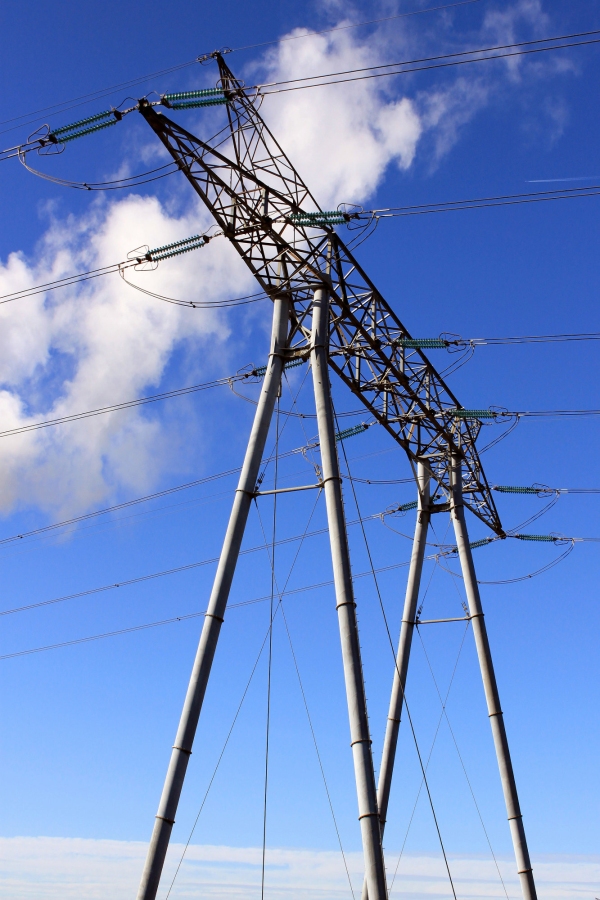 An electrical pylon against blue sky