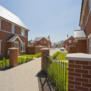 A new housing development nearing completion with empty houses