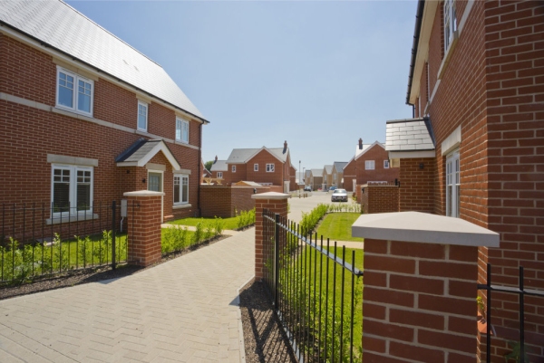 A new housing development nearing completion with empty houses