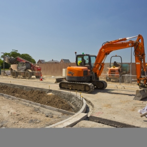 Road building on a new housing development with diggers and fork lift trucks