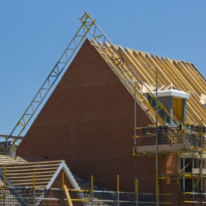 Putting the roof on a new house