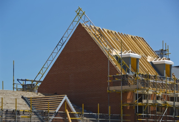 Putting the roof on a new house