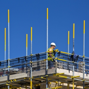 Bricklayer working on scaffolding