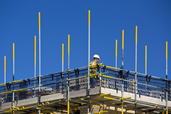 Bricklayer working on scaffolding