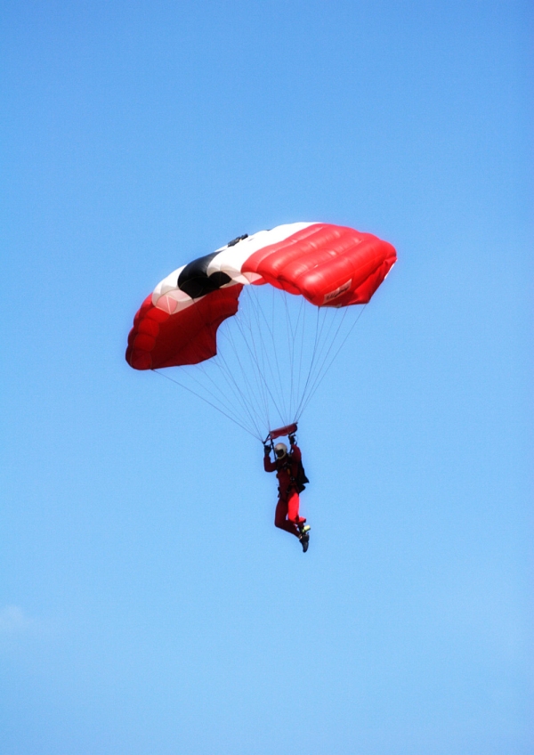 A member of the Parachute Regiment display team about to land