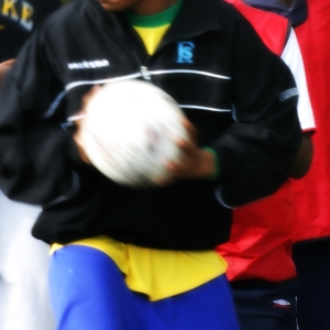 Teenage boys engaged in football practice and a training session