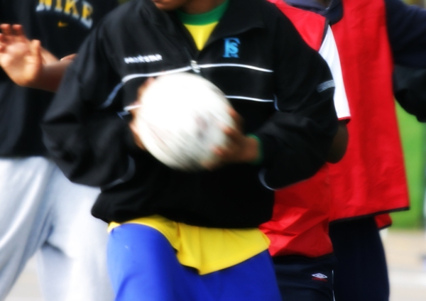 Teenage boys engaged in football practice and a training session