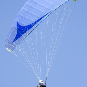 Paragliding on a hot summer's day against a perfect blue sky