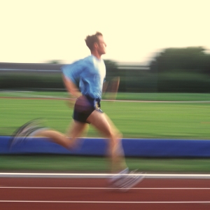 An athlete running on a running track