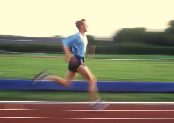 An athlete running on a running track