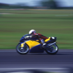 A motor cycle race with speeding bikes and high speed cornering