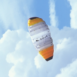 A parachute against a perfect summer sky