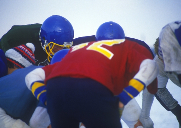 American football training session in the winter snow