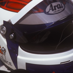 A crash helmet on the roof of a racing car at Rockingham raceway