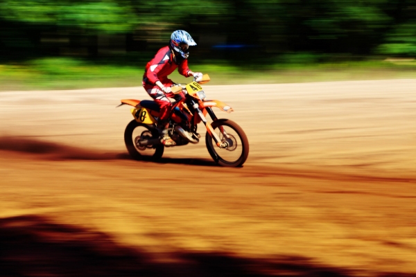 A motocross biker at full speed