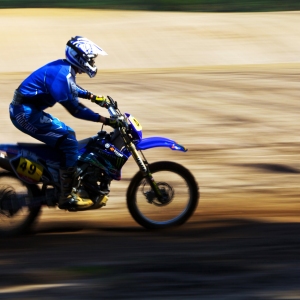 A motocross biker at speed