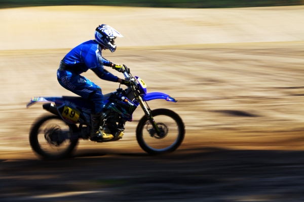 A motocross biker at speed