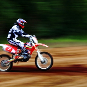 An enduro motorcyclist at speed