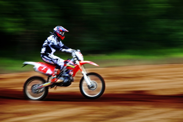 An enduro motorcyclist at speed