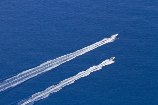 Aerial photo of two speedboats racing across the water