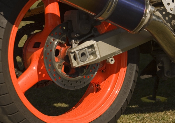 The rear wheel of a racing motorcycle close up