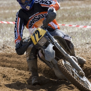 Motocross rider cornering at speed