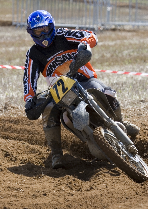 Motocross rider cornering at speed