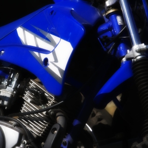 A close up view of the engine area of a professional racing bike