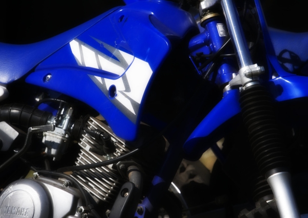 A close up view of the engine area of a professional racing bike